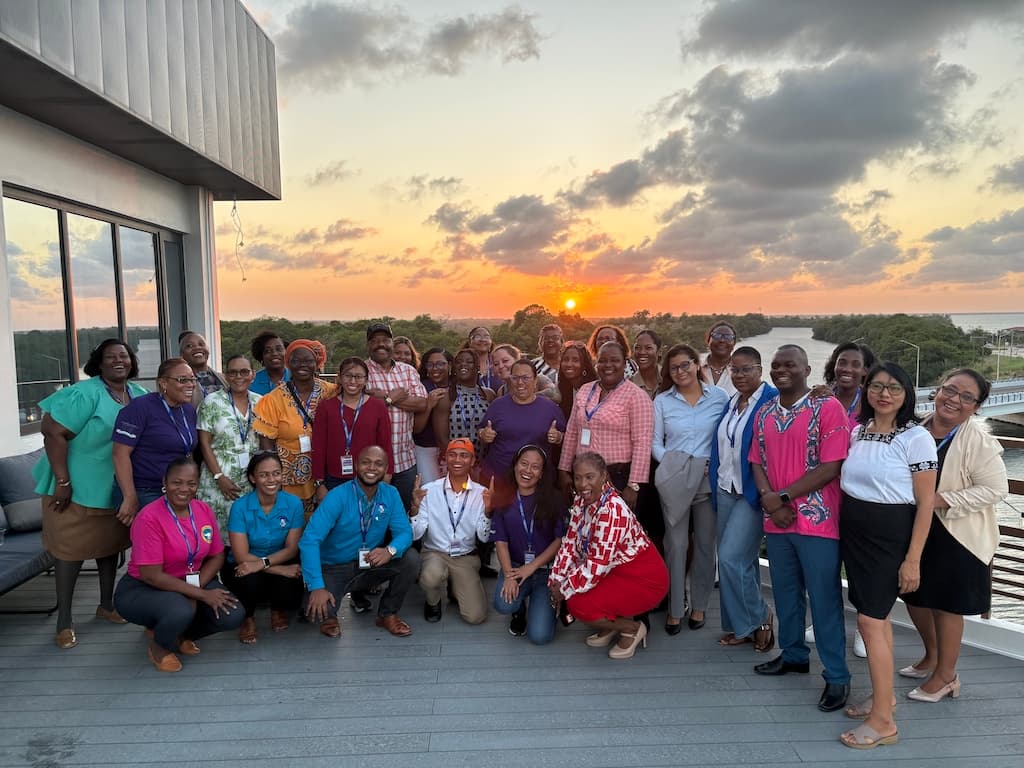Rooftop celebration at sunset over the Belize River